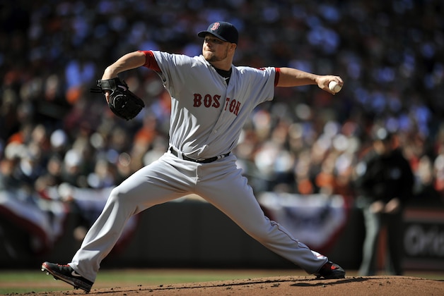 Mar 31, 2014; Baltimore, MD, USA; Boston Red Sox starting pitcher Jon Lester (31) throws in the first inning during an opening day game against the Baltimore Orioles at Oriole Park at Camden Yards. Mandatory Credit: Joy R. Absalon-USA TODAY Sports