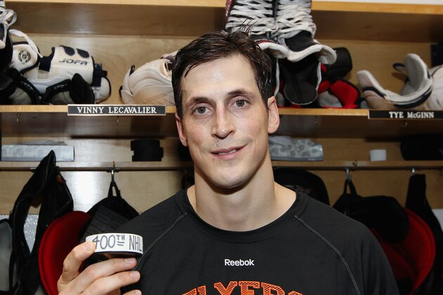 PHILADELPHIA, PA - MARCH 30: Vincent Lecavalier #40 of the Philadelphia Flyers poses with his 400th NHL goal puck after his game against the Boston Bruins on March 30, 2014 at the Wells Fargo Center in Philadelphia, Pennsylvania. The Bruins went on to defeat the Flyers 4-3 in a shoot-out. (Photo by Len Redkoles/NHLI via Getty Images)