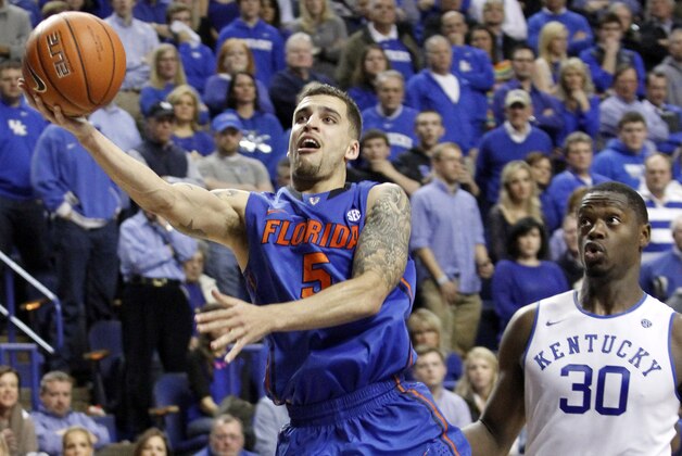 Florida's Scottie Wilbekin (5) shoots near Kentucky's Julius Randle (30) during the second half of an NCAA college basketball game on Saturday, Feb. 15, 2014, in Lexington, Ky. Florida won 69-59. (AP Photo/James Crisp) Florida's Scottie Wilbekin (5) shoots near Kentucky's Julius Randle (30) during the second half of an NCAA college basketball game on Saturday, Feb. 15, 2014, in Lexington, Ky. Florida won 69-59. (AP Photo/James Crisp)