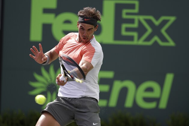 Rafael Nadal, of Spain, returns to Novak Djokovic, of Serbia, during the men's final at the Sony Open Tennis tournament, Sunday, March 30, 2014, in Key Biscayne, Fla. (AP Photo/Lynne Sladky)