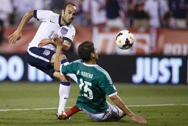 Sep 10, 2013; Columbus, OH, USA; United States forward Landon Donovan (10) is defended by Mexico defender Hector Moreno (15) in the first half at Columbus Crew Stadium. Mandatory Credit: Rick Osentoski-USA TODAY Sports