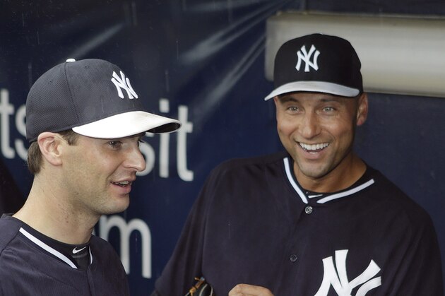 New York Yankees starting pitcher Shane Greene, left, shares a laugh with shortstop Derek Jeter as the pair wait out a rain delay in the dugout before the Yankees final spring exhibition baseball game against the Miami Marlins in Tampa, Fla., Saturday, March 29, 2014. The game was canceled because of rain. (AP Photo/Kathy Willens)