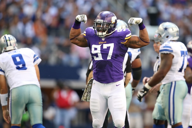 Minnesota Vikings defensive end Jared Allen (69) and defensive tackle Sharrif Floyd (95) celebrate in the first half of an NFL football game against the Dallas Cowboys Sunday, Nov. 3, 2013, in Arlington, Texas. (AP Photo/Nam Y. Huh)