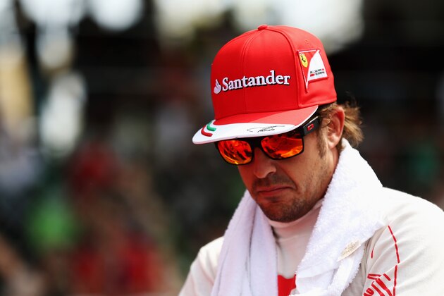 KUALA LUMPUR, MALAYSIA - MARCH 30:  Fernando Alonso of Spain and Ferrari prepares to drive during the Malaysia Formula One Grand Prix at the Sepang Circuit on March 30, 2014 in Kuala Lumpur, Malaysia.  (Photo by Mark Thompson/Getty Images)