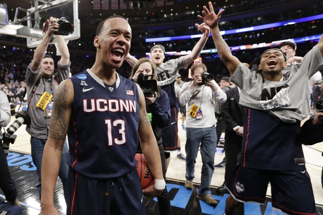 Connecticut's Shabazz Napier (13) celebrates after his team defeated Michigan State 60-54 in a regional final at the NCAA college basketball tournament, Sunday, March 30, 2014, in New York. Napier scored 17 points of his 25 points in the second half. (AP Photo/Frank Franklin II) Connecticut's Shabazz Napier (13) celebrates after his team defeated Michigan State 60-54 in a regional final at the NCAA college basketball tournament, Sunday, March 30, 2014, in New York. Napier scored 17 points of his 25 points in the second half. (AP Photo/Frank Franklin II)