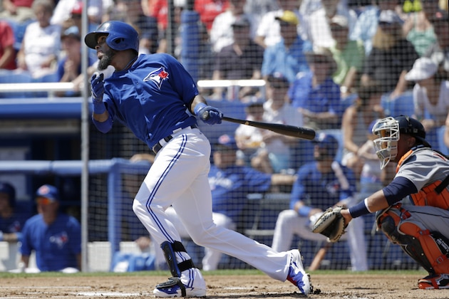 Toronto Blue Jays' Jose Reyes hits a first-inning double off Detroit Tigers starting pitcher Kyle Lobstein in a spring training baseball game against the Detroit Tigers in Dunedin, Fla., Saturday, March 22, 2014. The Jays defeated the Tigers 9-4. (AP Photo/Kathy Willens)