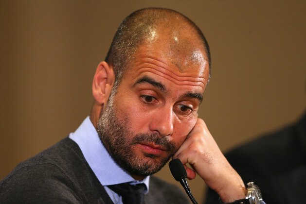 MANCHESTER, ENGLAND - MARCH 31:  Pep Guardiola the coach of FC Bayern Muenchen faces the media during a press conference at the Marriott Hotel on March 31, 2014 in Manchester, England.  (Photo by Alex Livesey/Getty Images)