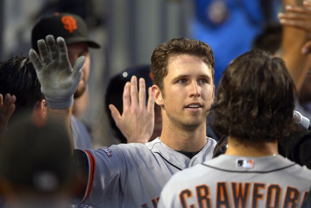 San Francisco Giants' Buster Posey, left, is congratulated after hitting a two-run home run as Los Angeles Dodgers catcher A.J. Ellis looks on during the fourth inning of their baseball game, Wednesday, June 26, 2013, in Los Angeles. (AP Photo/Mark J. Terrill) San Francisco Giants' Buster Posey, left, is congratulated after hitting a two-run home run as Los Angeles Dodgers catcher A.J. Ellis looks on during the fourth inning of their baseball game, Wednesday, June 26, 2013, in Los Angeles. (AP Photo/Mark J. Terrill)