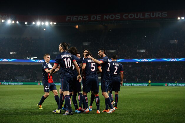 PARIS, FRANCE - MARCH 12:  Marquinhos of Paris Saint-Germain (5) celebrates with team mates as he scores their first goal during the UEFA Champions League Round of 16 second leg match between Paris Saint-Germain FC and Bayer Leverkusen at Parc des Princes on March 12, 2014 in Paris, France.  (Photo by Dean Mouhtaropoulos/Getty Images)