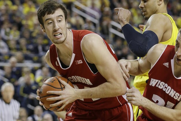 Wisconsin forward Frank Kaminsky (44) pulls down a rebound next to teammate guard Josh Gasser (21) during the first half of an NCAA college basketball game against Michigan in Ann Arbor, Mich., Sunday, Feb. 16, 2014. Kaminsky finished with 25 points in the Badgers 75-62 win. (AP Photo/Carlos Osorio) Wisconsin forward Frank Kaminsky (44) pulls down a rebound next to teammate guard Josh Gasser (21) during the first half of an NCAA college basketball game against Michigan in Ann Arbor, Mich., Sunday, Feb. 16, 2014. Kaminsky finished with 25 points in the Badgers 75-62 win. (AP Photo/Carlos Osorio)