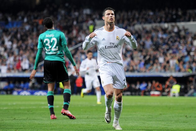 MADRID, SPAIN - MARCH 18:  Cristiano Ronaldo of Real Madrid celebrates after scoring his team's second goal during the UEFA Champions League Round of 16, second leg match between Real Madrid and FC Schalke 04 at Estadio Santiago Bernabeu on March 18, 2014 in Madrid, Spain.  (Photo by Denis Doyle/Getty Images)