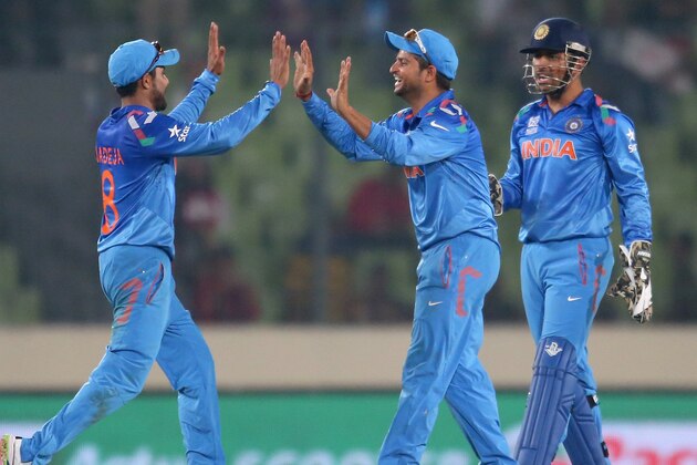 DHAKA, BANGLADESH - MARCH 30:  Ravindra Jadeja, Suresh Raina and MS Dhoni of India celebrate after winning the match during the ICC World Twenty20 Bangladesh 2014 match between India v Australia at Sher-e-Bangla Mirpur Stadium on March 30, 2014 in Dhaka, Bangladesh.  (Photo by Scott Barbour/Getty Images)