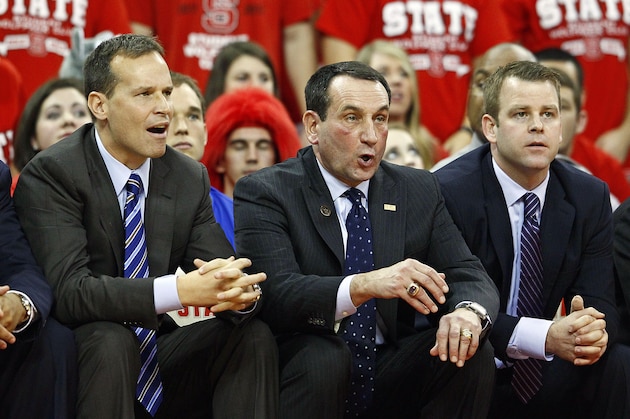 Duke head coach Mike Krzyzweski watches from the bench with assistant coaches Chris Collins, left, and Steve Wojciechowski, right during the second half of an NCAA college basketball game against North Carolina State in Raleigh, N.C., Saturday, Jan. 12, 2013. Duke lost 84-76. (AP Photo/Karl B DeBlaker)