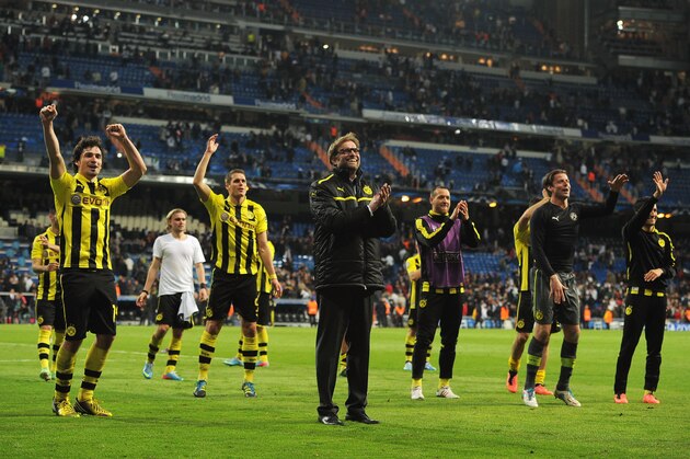 MADRID, SPAIN - APRIL 30:  Head Coach Jurgen Klopp of Borussia Dortmund celebrates with players as his team reach the final after the UEFA Champions League Semi Final Second Leg match between Real Madrid and Borussia Dortmund at Estadio Santiago Bernabeu on April 30, 2013 in Madrid, Spain.  (Photo by Gonzalo Arroyo Moreno/Getty Images)