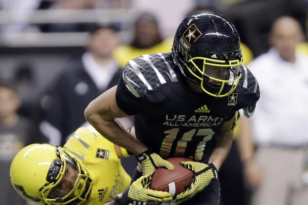U.S. Army All-American East's Jacob Park (10) is sacked by U.S. Army All-American West's Sione Teuhema (19) during the U.S. Army All-American Bowl football game, Saturday, Jan. 4, 2014, in San Antonio. (AP Photo/Eric Gay)