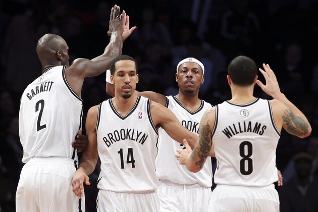 Brooklyn Nets forward Paul Pierce (34), second from right, celebrates with forward Kevin Garnett (2), point guard Shaun Livingston (14), and point guard Deron Williams (8) after scoring in the second half of an NBA basketball game against the Charlotte Bobcats, Wednesday, Feb. 12, 2014, in New York. The Nets won 105-89. (AP Photo/John Minchillo) Brooklyn Nets forward Paul Pierce (34), second from right, celebrates with forward Kevin Garnett (2), point guard Shaun Livingston (14), and point guard Deron Williams (8) after scoring in the second half of an NBA basketball game against the Charlotte Bobcats, Wednesday, Feb. 12, 2014, in New York. The Nets won 105-89. (AP Photo/John Minchillo)
