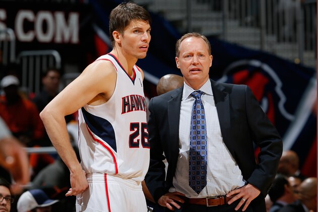 ATLANTA, GA - DECEMBER 06:  Kyle Korver #26 and Mike Budenholzer of the Atlanta Hawks converse during the game against the Cleveland Cavaliers at Philips Arena on December 6, 2013 in Atlanta, Georgia.  NOTE TO USER: User expressly acknowledges and agrees that, by downloading and or using this photograph, User is consenting to the terms and conditions of the Getty Images License Agreement.  (Photo by Kevin C. Cox/Getty Images)