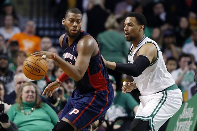 Detroit Pistons' Greg Monroe (10) looks to move against Boston Celtics' Jared Sullinger (7) in the fourth quarter of an NBA basketball game in Boston, Sunday, March 9, 2014. The Celtics won 118-111. (AP Photo/Michael Dwyer)