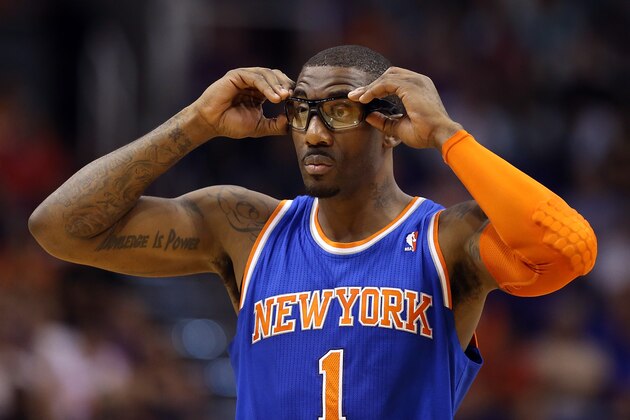 PHOENIX, AZ - MARCH 28:  Amar'e Stoudemire #1 of the New York Knicks adjusts his eye wear during the first half of the NBA game against the Phoenix Suns at US Airways Center on March 28, 2014 in Phoenix, Arizona.  NOTE TO USER: User expressly acknowledges and agrees that, by downloading and or using this photograph, User is consenting to the terms and conditions of the Getty Images License Agreement.  (Photo by Christian Petersen/Getty Images)