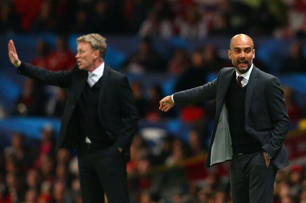 MANCHESTER, ENGLAND - APRIL 01:  David Moyes manager of Manchester United and Pep Guardiola head coach of Bayern Muenchen give instructions during the UEFA Champions League Quarter Final first leg match between Manchester United and FC Bayern Muenchen at Old Trafford on April 1, 2014 in Manchester, England.  (Photo by Alex Livesey/Getty Images)