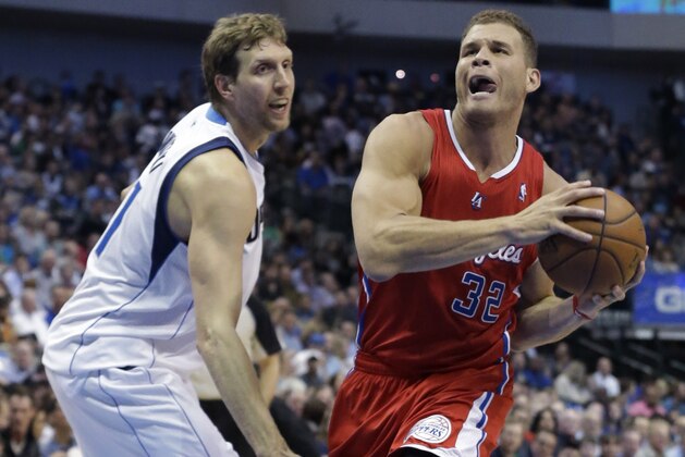 Los Angeles Clippers forward Blake Griffin (32) drives past Dallas Mavericks forward Dirk Nowitzki (41) during the first half of an NBA basketball game Thursday, March 27, 2014, in Dallas. (AP Photo/LM Otero)