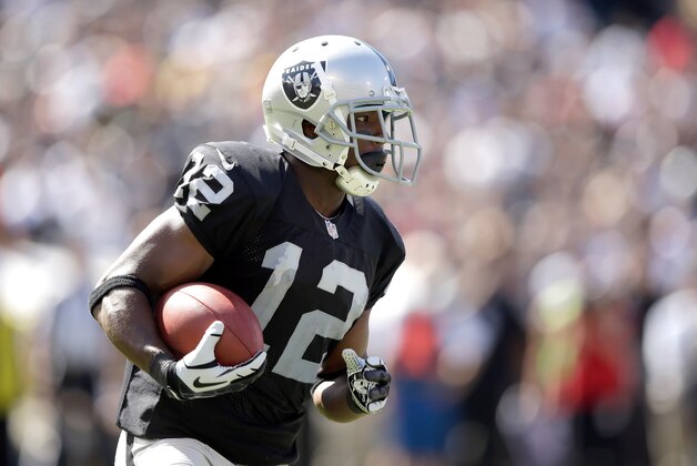 Oakland Raiders wide receiver Jacoby Ford (12) runs against Jacksonville Jaguars cornerback Alan Ball (23) during an NFL football game in Oakland, Calif., Sunday, Sept. 15, 2013. (AP Photo/Ben Margot)