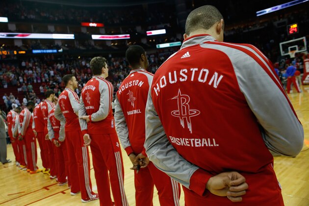 HOUSTON, TX - MARCH 29: Members of the Houston Rockets stand during the National Anthem before the game against the Los Angeles Clippers at the Toyota Center on March 29, 2014 in Houston, Texas. NOTE TO USER: User expressly acknowledges and agrees that, by downloading and or using this photograph, User is consenting to the terms and conditions of the Getty Images License Agreement. (Photo by Scott Halleran/Getty Images) HOUSTON, TX - MARCH 29: Members of the Houston Rockets stand during the National Anthem before the game against the Los Angeles Clippers at the Toyota Center on March 29, 2014 in Houston, Texas. NOTE TO USER: User expressly acknowledges and agrees that, by downloading and or using this photograph, User is consenting to the terms and conditions of the Getty Images License Agreement. (Photo by Scott Halleran/Getty Images)