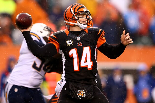 CINCINNATI, OH - JANUARY 05:  Quarterback Andy Dalton #14 of the Cincinnati Bengals passes against the San Diego Chargers during a Wild Card Playoff game at Paul Brown Stadium on January 5, 2014 in Cincinnati, Ohio.  (Photo by Andy Lyons/Getty Images)