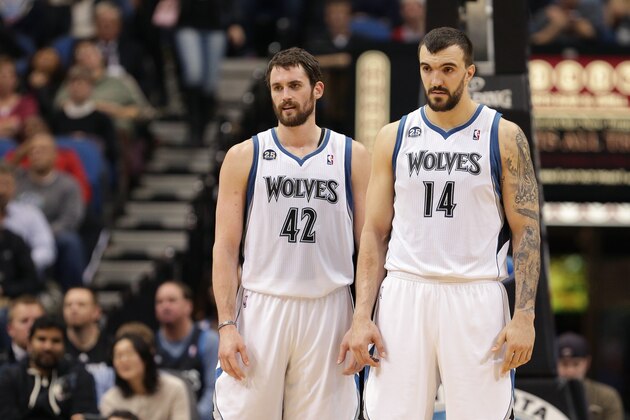 MINNEAPOLIS, MN - NOVEMBER 6:   Kevin Love #42 and Nikola Pekovic #14 of the Minnesota Timberwolves stand on the court against the Golden State Warriors on November 6, 2013 at Target Center in Minneapolis, Minnesota. NOTE TO USER: User expressly acknowledges and agrees that, by downloading and or using this Photograph, user is consenting to the terms and conditions of the Getty Images License Agreement. Mandatory Copyright Notice: Copyright 2013 NBAE (Photo by Jordan Johnson/NBAE via Getty Images)
