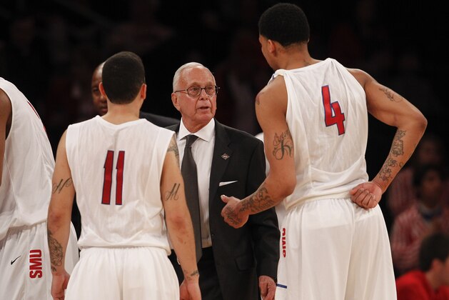 NEW YORK, NY - APRIL 1:   Head coach Larry Brown of the Southern Methodist Mustangs talks with Keith Frazier