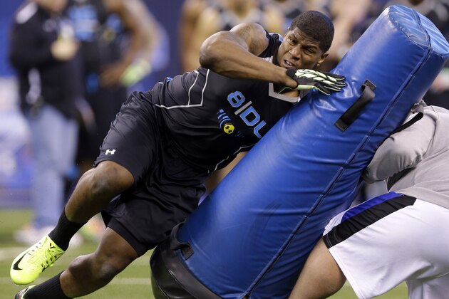 Missouri defensive lineman Kony Ealy runs a drill at the NFL football scouting combine in Indianapolis, Monday, Feb. 24, 2014. (AP Photo/Michael Conroy)