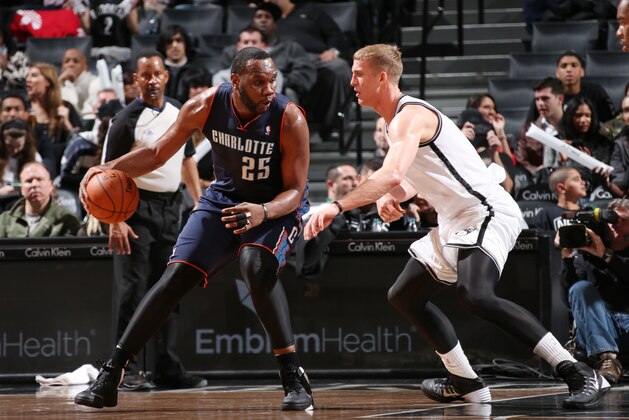 NEW YORK, NY - MARCH 19: Al Jefferson #25 of the Charlotte Bobcats controls the ball against Mason Plumlee #1 of the Brooklyn Nets at the Barclays Center on March 19, 2014 in the Brooklyn borough of New York City in New York City. NOTE TO USER: User expressly acknowledges and agrees that, by downloading and or using this photograph, User is consenting to the terms and conditions of the Getty Images License Agreement. Mandatory Copyright Notice: Copyright 2014 NBAE (Photo by Ned Dishman/NBAE via Getty Images)