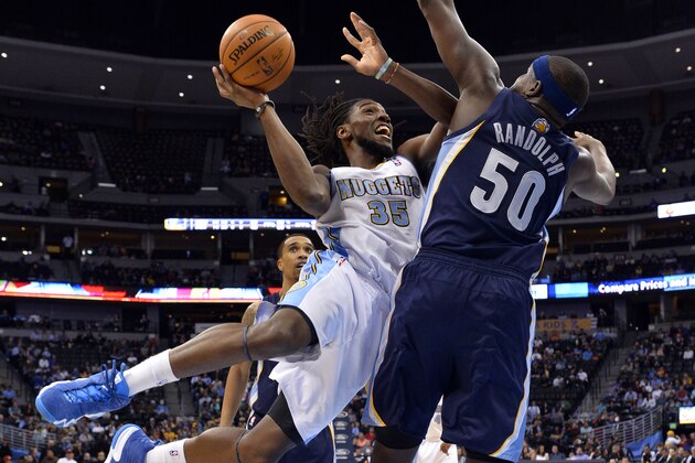 Denver Nuggets forward Kenneth Faried (35) goes up for a shot against Memphis Grizzlies forward Zach Randolph (50) during the third quarter of an NBA basketball game on Monday, March 31, 2014, in Denver. (AP Photo/Jack Dempsey)