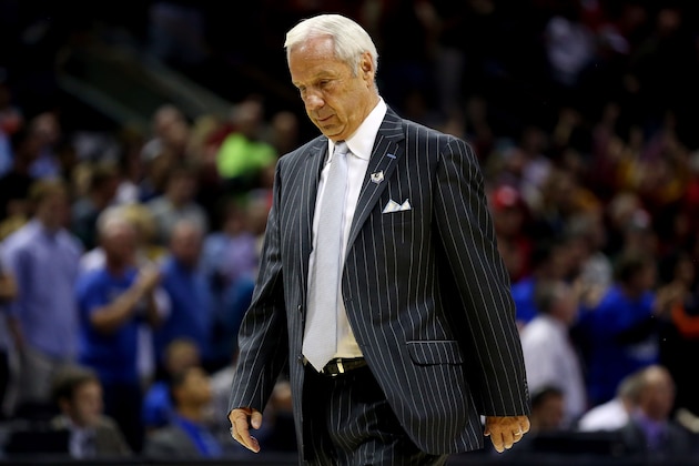 SAN ANTONIO, TX - MARCH 23: Head coach Roy Williams of the North Carolina Tar Heels walks off the court after losing to the Iowa State Cyclones 85-83 during the third round of the 2014 NCAA Men's Basketball Tournament at the AT&T Center on March 23, 2014 in San Antonio, Texas.  (Photo by Ronald Martinez/Getty Images)
