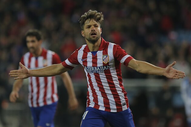 Atletico's Diego Ribas, celebrates his goal during a Spanish La Liga soccer match between Atletico de Madrid and  Real Sociedad at the Vicente Calderon stadium in Madrid, Spain, Sunday, Feb. 2, 2014. (AP Photo/Andres Kudacki)