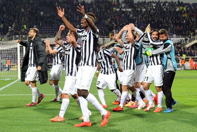 Juventus players celebrate at the end of an Europa League, round of 16, return-leg soccer  match between Fiorentina and Juventus at the Artemio Franchi stadium in Florence, Italy, Thursday, March 20, 2014. Juventus won 1-0. (AP Photo/ Massimo Pinca)