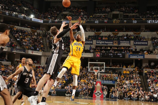 INDIANAPOLIS - MARCH 31: Paul George #24 of the Indiana Pacers shoots against the San Antonio Spurs at Bankers Life Fieldhouse on March 31, 2014 in Indianapolis, Indiana.  NOTE TO USER: User expressly acknowledges and agrees that, by downloading and or using this Photograph, user is consenting to the terms and condition of the Getty Images License Agreement. Mandatory Copyright Notice: 2014 NBAE  (Photo by Ron Hoskins/NBAE via Getty Images)