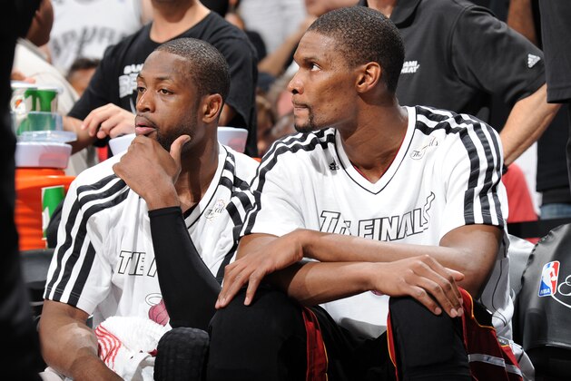 SAN ANTONIO, TX - JUNE 16: Dwyane Wade #3 and Chris Bosh #1 of the Miami Heat sit on the bench during Game Five of the 2013 NBA Finals against the San Antonio Spurs on June 16, 2013 at the AT&T Center in San Antonio, Texas. NOTE TO USER: User expressly acknowledges and agrees that, by downloading and or using this photograph, User is consenting to the terms and conditions of the Getty Images License Agreement. Mandatory Copyright Notice: Copyright 2013 NBAE (Photo by Andrew D. Bernstein/NBAE via Getty Images)
