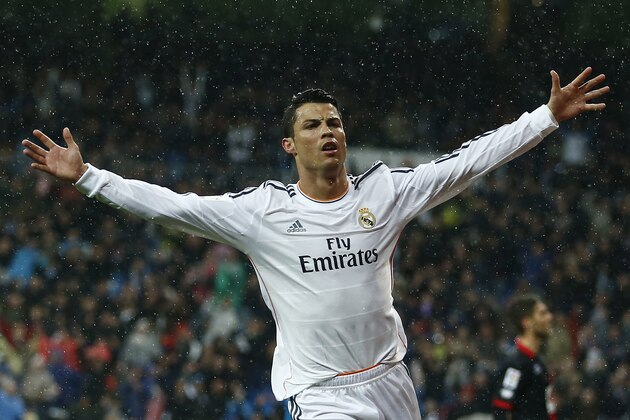 Real's Cristiano Ronaldo celebrates his goal during a Spanish La Liga soccer match between Real Madrid and Rayo Vallecano at the Santiago Bernabeu stadium in Madrid, Spain, Saturday, March 29, 2014. (AP Photo/Andres Kudacki)