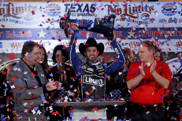 Jimmie Johnson (48) burns his tires after winning the NASCAR Sprint Cup series auto race at Texas Motor Speedway in Fort Worth, Texas, Sunday, Nov. 3, 2013. (AP Photo/Larry Papke)