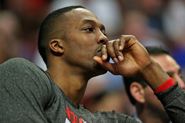 CHICAGO, IL - MARCH 13: Dwight Howard#12 of the Houston Rockets watches the end of the fourth quarter against the Chicago Bulls from the bench at the United Center on March 13, 2014 in Chicago, Illinois. The Bulls defeated the Rockets 111-87. NOTE TO USER: User expressly acknowledges and agrees that, by downloading and or using this photograph, User is consenting to the terms and conditions of the Getty Images License Agreement. (Photo by Jonathan Daniel/Getty Images)