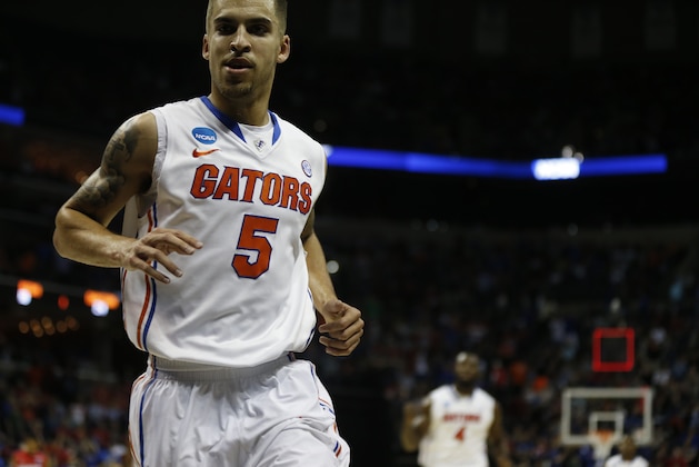 Florida guard Scottie Wilbekin (5) runs off the court against Dayton during the first half in a regional final game at the NCAA college basketball tournament, Saturday, March 29, 2014, in Memphis, Tenn. (AP Photo/John Bazemore)