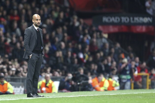 Bayern head coach Pep Guardiola watches the Champions League quarterfinal first leg soccer match between Manchester United and Bayern Munich at Old Trafford Stadium, Manchester, England, Tuesday, April 1, 2014.(AP Photo/Jon Super) Bayern head coach Pep Guardiola watches the Champions League quarterfinal first leg soccer match between Manchester United and Bayern Munich at Old Trafford Stadium, Manchester, England, Tuesday, April 1, 2014.(AP Photo/Jon Super)