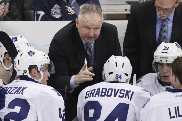 Toronto Maple Leafs coach Randy Carlyle gives instructions from behind the bench during the third period of an NHL hockey game against the Pittsburgh Penguins in Pittsburgh Wednesday, March 7, 2012. The Penguins won 3-2. (AP Photo/Gene J. Puskar)