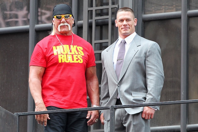 This image released by Starpix shows professional wresting personalities Hulk Hogan, left, and John Cena on top of the The Hard Rock Cafe during a news conference for Wrestlemania 30 on Tuesday, April 1, 2014 in New York. Wrestlemania 30 will be held on Sunday, April 6 in New Orleans .  (AP Photo/Starpix, Dave Allocca)