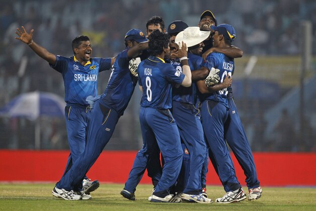 Sri Lanka players celebrates their victory against New Zealand during their ICC Twenty20 Cricket World Cup match in Chittagong, Bangladesh, Monday, March 31, 2014. Sri Lanka won by 59 runs. (AP Photo/A.M. Ahad)