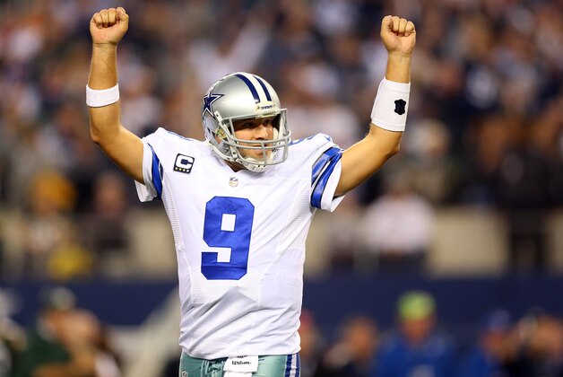 ARLINGTON, TX - DECEMBER 15:  Quarterback Tony Romo #9 of the Dallas Cowboys reacts against the Green Bay Packers during a game at AT&T Stadium on December 15, 2013 in Arlington, Texas.  (Photo by Ronald Martinez/Getty Images)