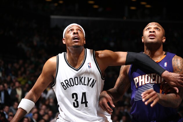 BROOKLYN, NY - MARCH 17: Paul Pierce #34 of the Brooklyn Nets boxes out against P.J. Tucker #17 of the Phoenix Suns during a game at Barclays Center in Brooklyn. NOTE TO USER: User expressly acknowledges and agrees that, by downloading and or using this photograph, User is consenting to the terms and conditions of the Getty Images License Agreement. Mandatory Copyright Notice: Copyright 2014 NBAE (Photo by Nathaniel S. Butler/NBAE via Getty Images)