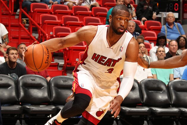 MIAMI, FL - March 16: Dwyane Wade #3 of the Miami Heat drives to the basket against the Houston Rockets at the American Airlines Arena in Miami, Florida on March 16 2014. NOTE TO USER: User expressly acknowledges and agrees that, by downloading and/or using this photograph, user is consenting to the terms and conditions of the Getty Images License Agreement. Mandatory copyright notice: Copyright NBAE 2014 (Photo by Issac Baldizon/NBAE via Getty Images)