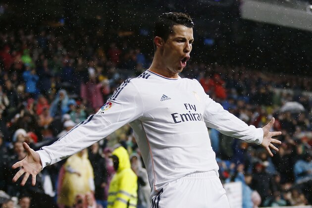 10ThingstoSeeSports - Real's Cristiano Ronaldo celebrates his goal during a Spanish La Liga soccer match between Real Madrid and Rayo Vallecano at the Santiago Bernabeu stadium in Madrid, Spain, Saturday, March 29, 2014. (AP Photo/Andres Kudacki, File)